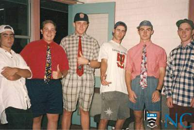 Photograph of residents wearing shorts and ties.
